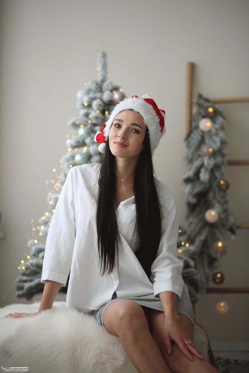 Ukrainian beauty shows sexy lingerie in front of Christmas tree