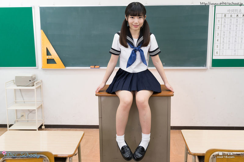 Petite Japanese schoolgirl strips off her clothes and stands naked in the classroom